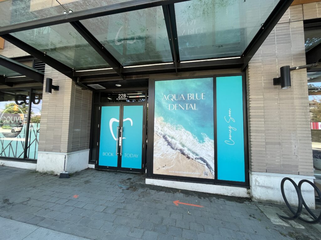 cooming soon vinyl storefront wrap
