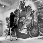 graphic installation of a vinyl wall mural, vancovuer bc